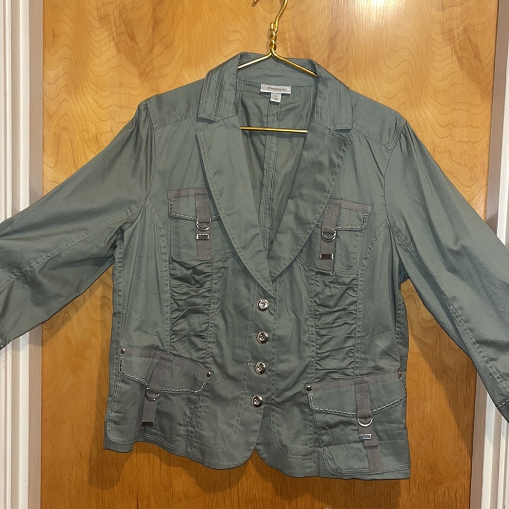 Army green jacket with silver buttons and trim. Not wrinkled, ruching panels.